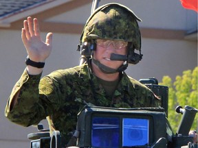 A soldier in a turret of an armoured vehicle