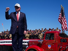 U.S. President Donald Trump departs after speaking during a