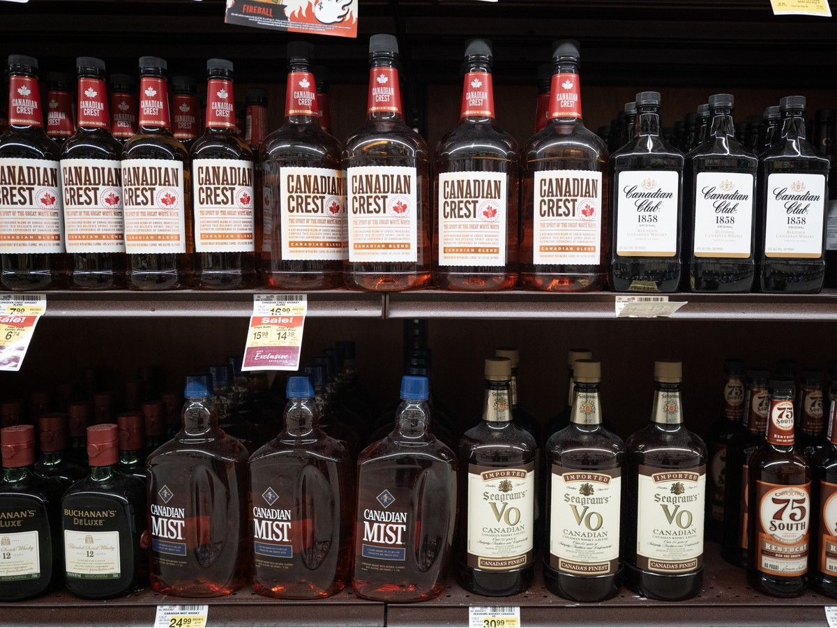 Bottles of whisky on a store shelf.
