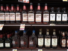 Bottles of whisky on a store shelf.