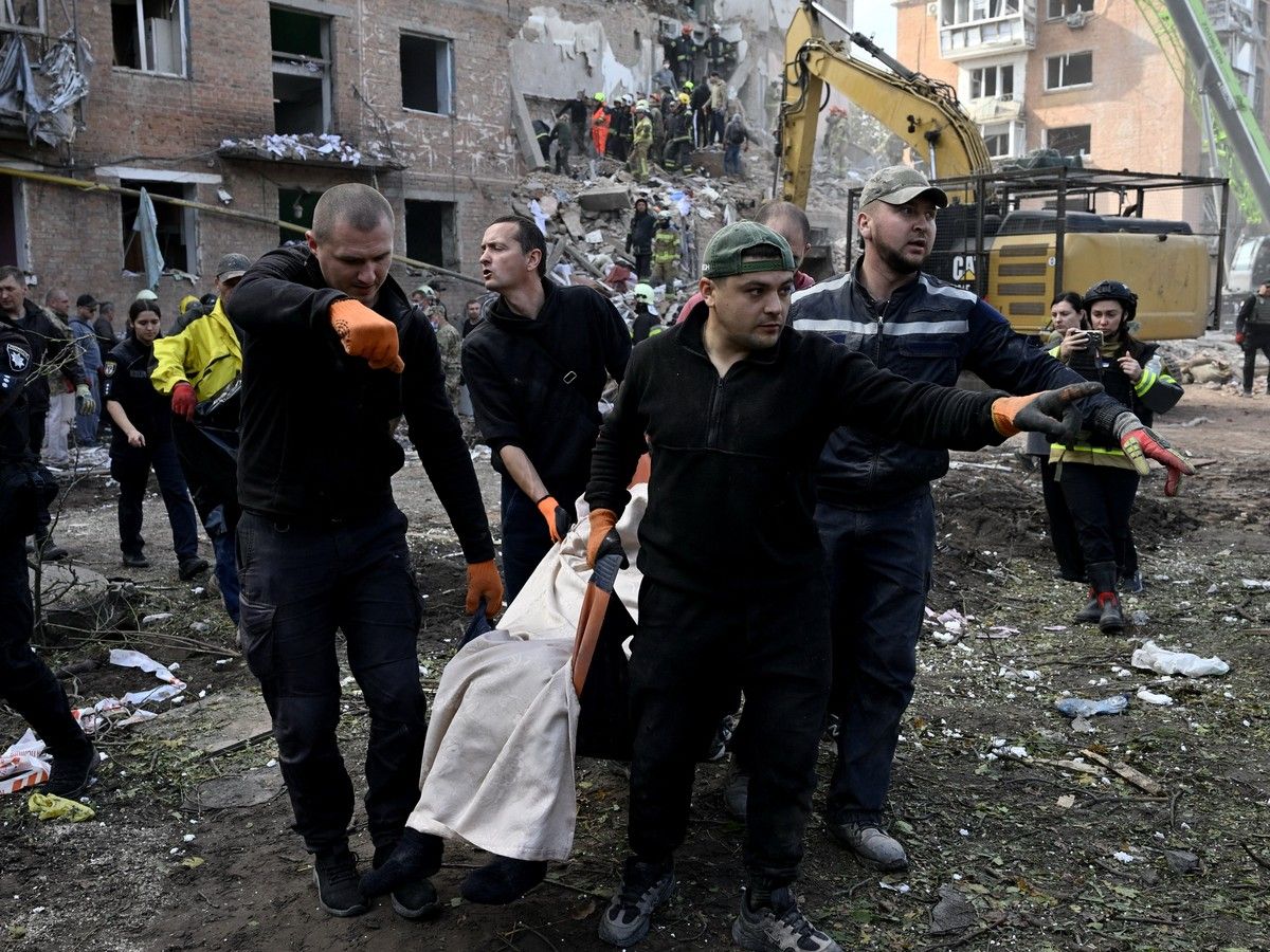 Rescuers moving a body