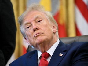 A close up of Donald Trump in the Oval Office at the White House.