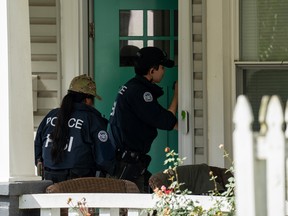 Homeland Security Investigations police enter a home