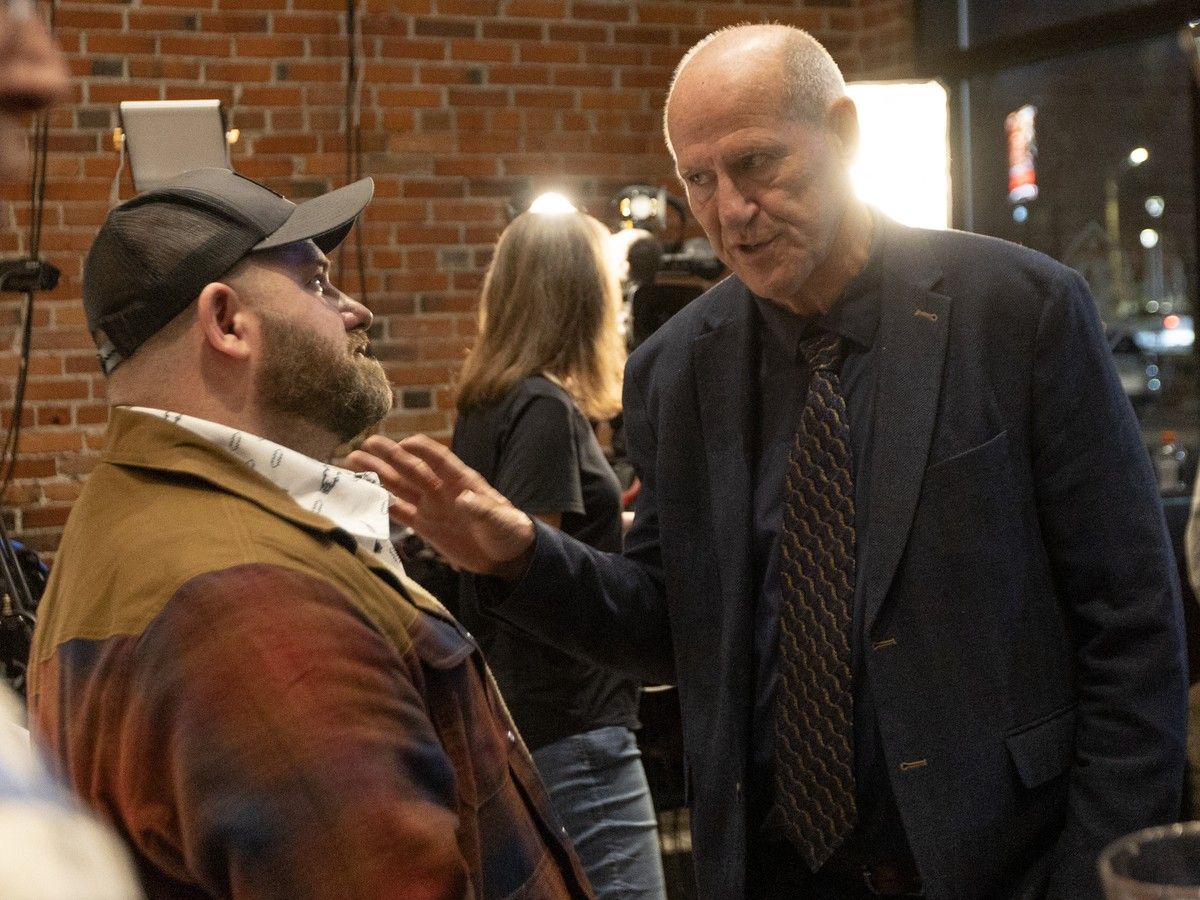 Alberta Prosperity Project CEO Mitch Sylvestre, right, speaks with a supporter