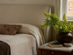 The bedroom is all softness, perfect for relaxing after a long day. New marble tops and fancy hardware transform the bedside tables, which are also family pieces.