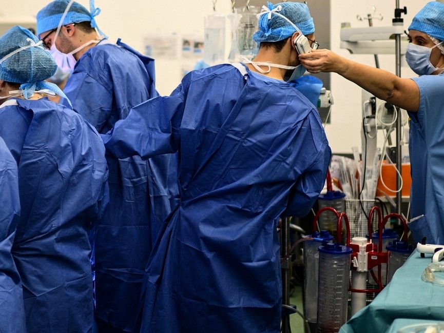 Doctor in operating room on a phone call