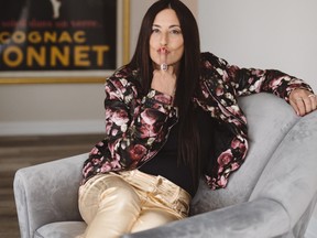 Rebecca Eckler sits in a chair and answers readers questions.