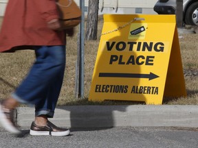 A voter enters a parking lot in Calgary