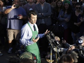 Nathan Fielder in a crowd wearing a Starbuck apron.
