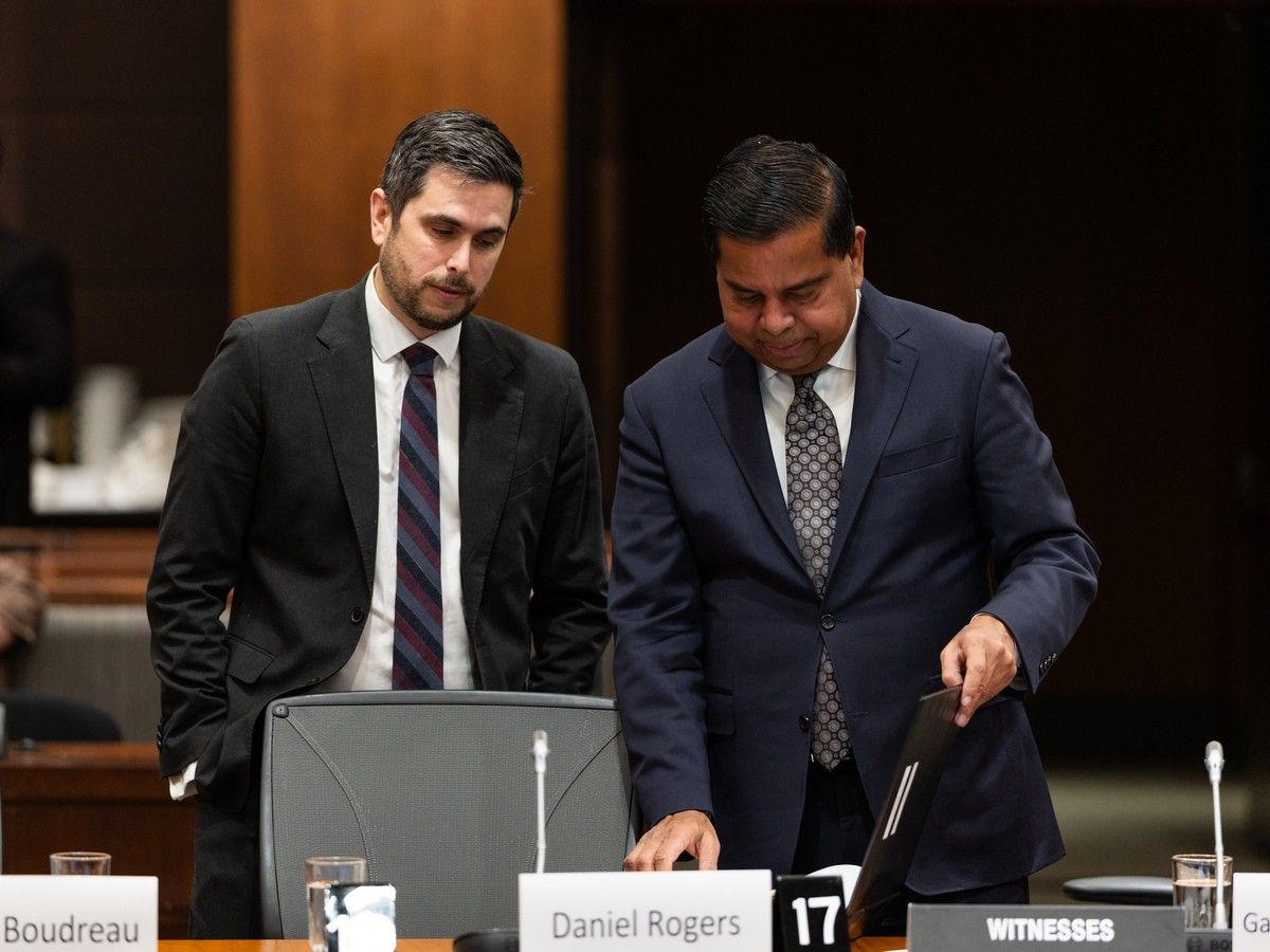 CSIS director Daniel Rogers and Minister of Public Safety Gary Anandasangaree chat before a committee meeting.