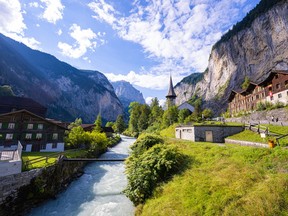 The village of Lauterbrunnen is framed by imposing cliffs and 72 waterfalls that cascade down to the valley floor.