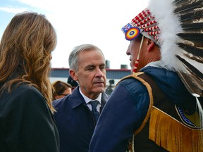 Danielle Smith, Mark Carney and Raymond Powder.