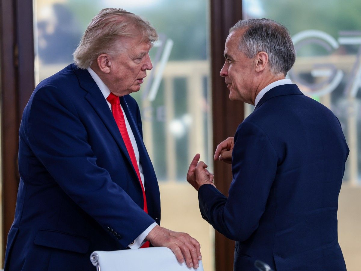 U.S. President Donald Trump speaks with Canadian Prime Minister Mark Carney
