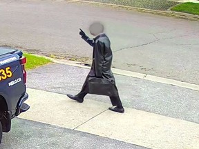 Teen wearing a trench coat.