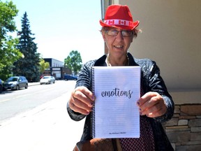 Melissa J. Weiler holds her first poetry book, Emotions, self-published with funding from the Ontario Disability Support Program. Weiler was diagnosed with a learning disability and required speech therapy when she was younger, but despite all odds managed to finish high school and eventually, write her first book.