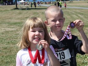 Evie and Jacob Physk proudly show off the participation medals they were given in the Cornwall Multisport Club Kids' Run on Saturday July 7, 2018 in Cornwall, Ont.
Lois Ann Baker/Cornwall Standard-Freeholder/Postmedia Network