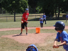 Chris Poirier delivers a pitch, during a scrimmage at the River's Edge Baseball Camp on on Tuesday, July 10, 2018, in Cornwall, Ont. 
Todd Hambleton/Cornwall Standard-Freeholder/Postmedia Network