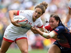 Canada's Breanne Nicholas of Blenheim, Ont., pushes away from the defence in the women's bronze match against Russia during Day 3 of the 2018 Sydney Sevens at Allianz Stadium on January 28, 2018 in Sydney, Australia. BRADLEY KANARIS/Getty Images