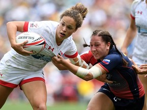 Canada's Breanne Nicholas of Blenheim, Ont., pushes away from the defence in the women's bronze match against Russia during Day 3 of the 2018 Sydney Sevens at Allianz Stadium on January 28, 2018 in Sydney, Australia. BRADLEY KANARIS/Getty Images