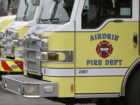 Firetrucks line up on the pavement outside of the Chinook Winds Fire Department on Friday May 15, 2015 in Airdrie, Alta. Britton Ledingham/Airdrie Echo/Postmedia Network