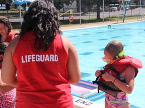 Lifeguards at the St. Francis pool help kids put on their PFDs during National Drowning Prevention Week activities on Wednesday July 18, 2018 in Cornwall, Ont. Alan S. Hale/Cornwall Standard-Freeholder/Postmedia Network