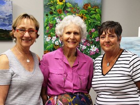 Carolyn Huff-Winters, past VAGA president; Mary Eagle, VAGA member; and Laurie McLaren, current president, at VAGAÕs opening of their brand new gallery at 186 King Street East in Gananoque on July 21, which was also their 25th anniversary as an organization.  Lorraine Payette/For Postmedia Network