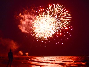 Beachgoers take in the fireworks at a packed Sauble Beach, Ont., on Canada Day on Sunday, July 1, 2018. Rob Gowan/The Owen Sound Sun Times/Postmedia Network