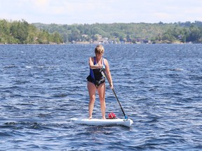 Anik Williams works on her stand up paddleboarding skills on Ramsey Lake in Sudbury, Ont. on Tuesday July 17, 2018.