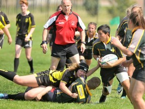 Gordon Anderson/Daily-Herald Tribune
Dani Franada of the Grande Prairie Sirens takes the ball out of a human pile up during the second half of the Edmonton Rugby Union game between the Sirens and the LA Crude at Macklin Field on Saturday afternoon. The Sirens grabbed a 24-20 win over the visitors.