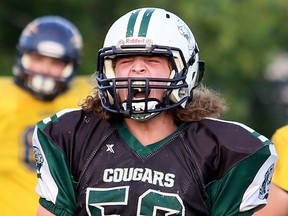 Chatham-Kent Cougars' Tanner Hoorelbeck (52) shouts after making a tackle against the Sault Sabercats in the OFC West Division junior varsity final at the Chatham-Kent Community Athletic Complex in Chatham, Ont., on Sunday, Aug. 5, 2018. Mark Malone/Chatham Daily News/Postmedia Network