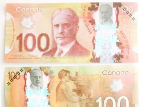 Counterfeit $100 bills. File photo