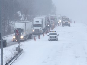 Cars and trucks are re-routed off Highway 401 near Lansdowne on March 15, 2017 due to a 30-car pileup and a chemical spill. (FILE PHOTO BY THE CANADIAN PRESS/Lars Hagberg)