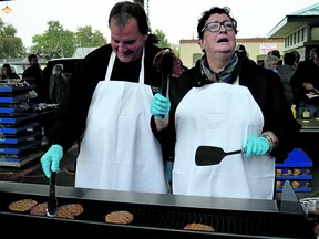 Mary-Pat Gleeson is shown in this file photo helping man the grill during a community barbecue in Petrolia. The former town councillor and health care advocate died Jan. 30.