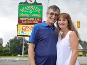 Nick Kanellis, left, and Trudy Kanellis stand in front of the iconic Wayside restaurant which Nick has owned since 1974. The couple are calling it quits this year but say the restaurant will live on at the corner of Sunset Drive and Highway 3 in Talbotville. (Louis Pin/Times-Journal)