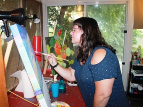 Wyoming artist Tracy Tobin puts the finishing touches on a painting in her home studio.
Carl Hnatyshyn/Sarnia This Week