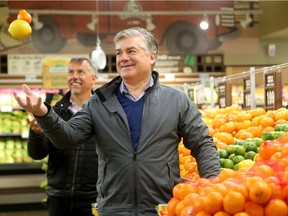 Farm Boy CEO's Jean Louis Bellemare and Jeff York (right) tour around their store on McRae in Ottawa - part of an aggressive expansion of the grocery store whose origins started in Cornwall in 1981.