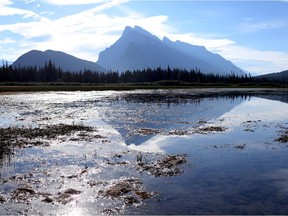 Mount Rundle casts a shadow on Vermilion Lakes in Banff National Park  on Aug. 29, 2013.