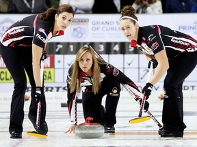 Skip Rachel Homan, centre, of Ottawa watches her rock with lead Lisa Weagle, left, and second Joanne Courtney during the third draw at the Grand Slam of Curling's Princess Auto Elite 10 at Thames Campus Arena in Chatham, Ont., on Thursday, Sept. 27, 2018. Mark Malone/Chatham Daily News/Postmedia Network