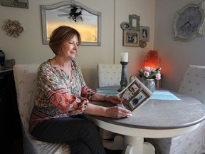 Diane Iahn holds up a page of information she gathered on her grandfather, Bernard Biggs, who was a British Home Child who was sent to the Westport area from England in 1912 to work on a farm. He was on of 100,000 children sent from the UK to Canada to work as cheap labour for families across the country. Meghan Balogh/The Whig-Standard/Postmedia Network