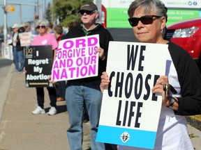 Anti-abortion protesters take part in Life Chain Sunday, Oct. 1, 2017 on Great Northern Road in Sault, Ste. Marie, Ont. Life Chain is held simultaneously in more than 200 locations across Canada annually. JEFFREY OUGLER/SAULT STAR/POSTMEDIA NETWORK