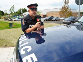 Const. Craig Peddle of the Owen Sound Police Service uses a radar gun to detect speeders in front of Owen Sound District Secondary School Tuesday, which was the first day back at school for most students in Grey-Bruce.
The police department says it will be focusing its traffic safety efforts over the next few weeks on enforcement and education in school zones. Officers will be on the lookout for drivers who are speeding, driving aggressively or driving while distracted. The police service will also be targeting illegal parking near schools.
Police are also reminding drivers about the increases to certain fines that came into effect Sept. 1. Failing to yield at pedestrian crosswalks, school crossings and crossovers, for example, will now come with a fine of up to $1,000 as well as four demerit points, while failing to stop for a school bus will carry a fine of up to $4,000 for each offence.
Denis Langlois/The Owen Sound Sun Times/Post Media Network