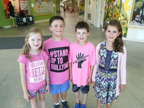 Walden Public School students Charlotte Andrews, 8, left, William MacIsaac, 7, Josh Ruppel, 8, and Ava-Jane Jamieson, 8, showed their support for Stand Up Against Bullying Day by wearing pink at the school in Lively, Ont. on Thursday September 13, 2018.
