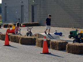 Kids play outside the Embro Community Centre during the annual Embro Fair in Embro, Ont. on Saturday September 15, 2018. (Greg Colgan/Woodstock Sentinel-Review)