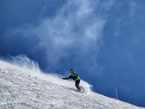 A snowboarder enjoys the great skiing conditions at Sunshine Village in Banff.