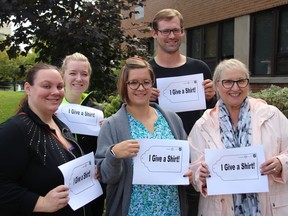 Danielle MacNeil from Maison Baldwin House, left, waste management supervisor Danielle Watson, Julie Leroux from the Salvation Army, Dave Kuhn and Johanne Couture from the Agape Centre hold up the paper bag tags that can be used to label donations for the upcoming Give a Shirt campaign on Thursday October 4, 2018 in Cornwall, Ont. It begins on Oct. 15.
Alan S. Hale/Cornwall Standard-Freeholder/Postmedia Network