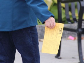 A woman with her voter card in hand heads to the polls in Cornwall  on Monday October 22, 2018 in Cornwall, Ont. Alan S. Hale/Cornwall Standard-Freeholder/Postmedia Network