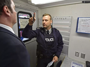 A police officer demonstrates a drug-impaired driving test.