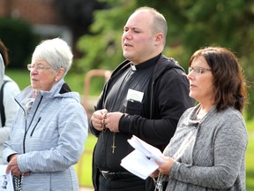 Arlette Beaulieu, Rev. Daniele Muscolino and Jennifer Esposti at rosary rally at Our Lady of Good Counsel in Sault Ste. Marie, Ont. on Saturday, Oct. 14, 2017 to mark 100th anniversary of Mary Mother of Jesus appearing at Fatima in Portugal.  (BRIAN KELLY/THE SAULT STAR/POSTMEDIA NETWORK)