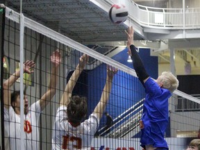 A Viking blocker makes a play close to the net against the Strathcona Lords during the SGCHS international tournament. Josh Thomas/Reporter/Examiner