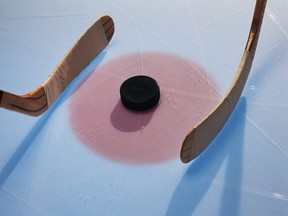 hockey sticks and puck